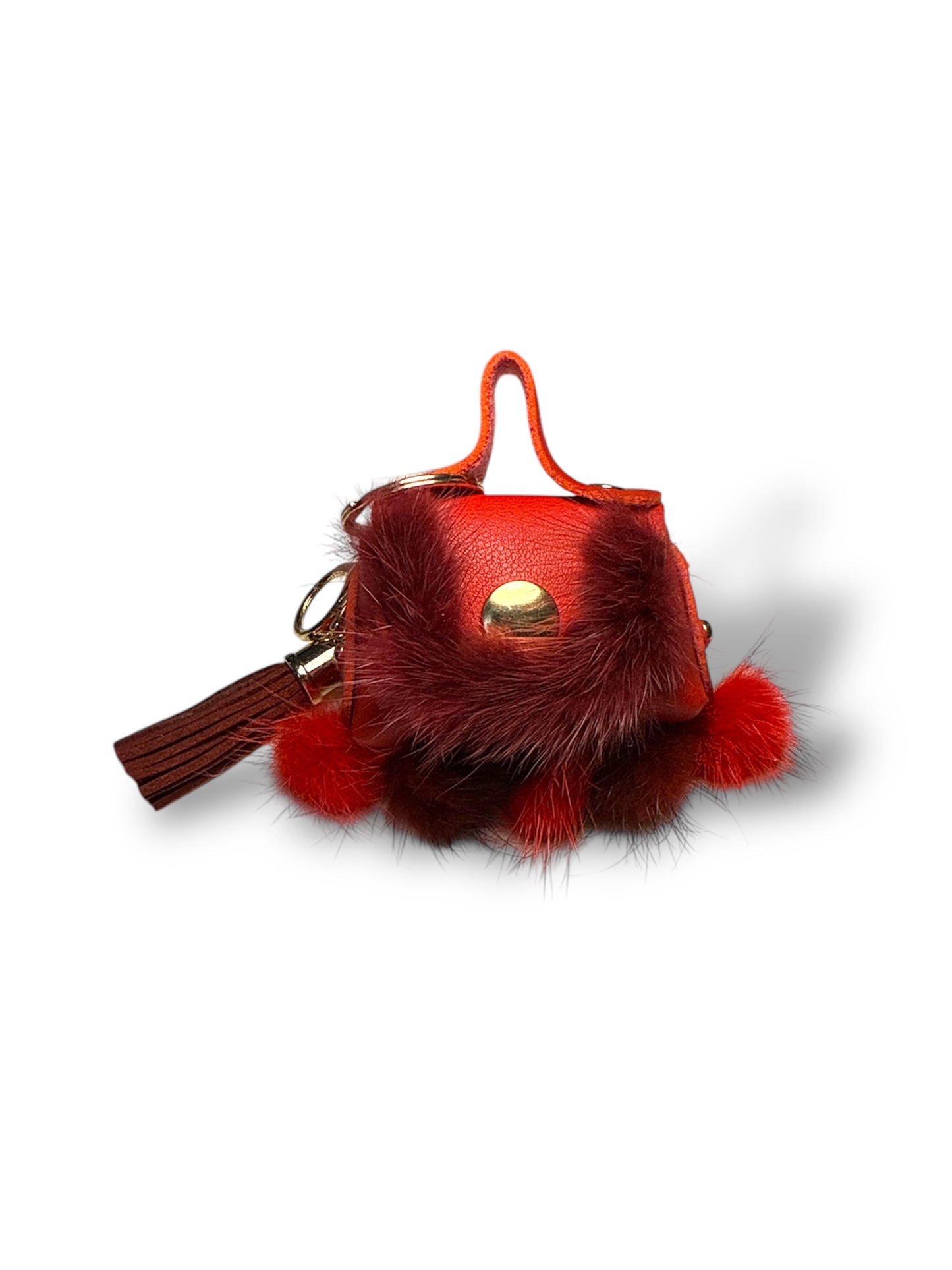 Charm a forma di borsetta con pompon e nappina